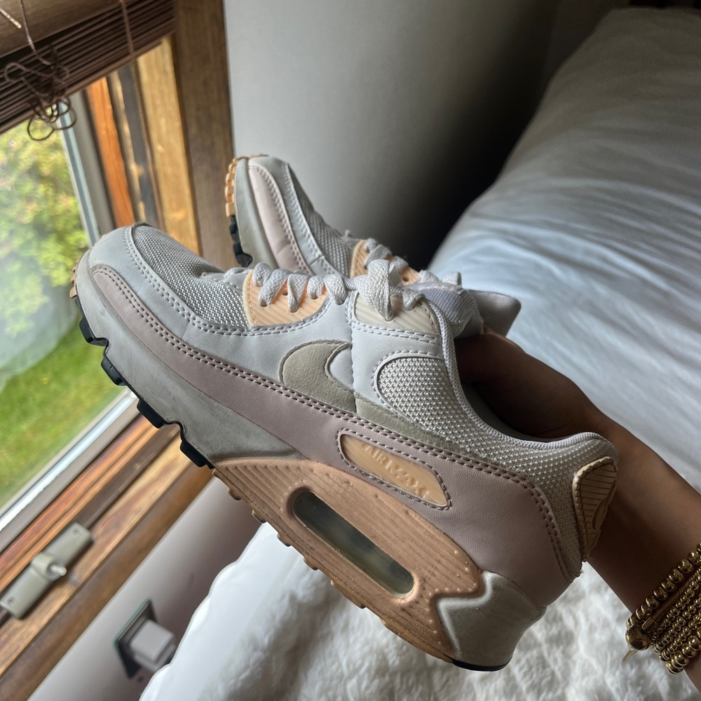 Pink and white Nike sneakers